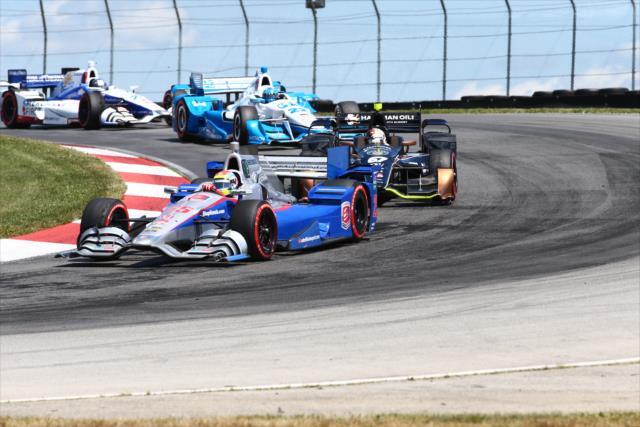 Justin Wilson leads a group through the Turn 2 Keyhole turn during the Honda Indy 200 at Mid-Ohio -- Photo by: Bret Kelley