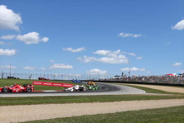 Scott Dixon and Helio Castroneves lead a group through the Turn 2 Keyhole turn during the Honda Indy 200 at Mid-Ohio -- Photo by: Bret Kelley