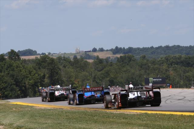 The field streaks down the backstretch during the Honda Indy 200 at Mid-Ohio -- Photo by: Chris Jones