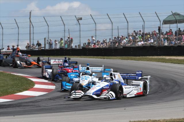 Marco Andretti leads a group through the Turn 2 Keyhole turn during the Honda Indy 200 at Mid-Ohio -- Photo by: Chris Jones