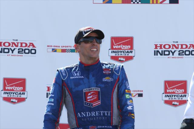 Justin Wilson on the Victory podium following his runner-up finish in the Honda Indy 200 at Mid-Ohio -- Photo by: Chris Jones