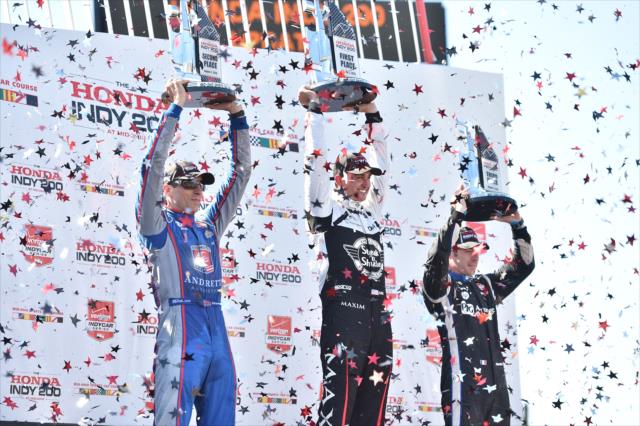 Graham Rahal, Justin Wilson, and Simon Pagenaud hoist their trophies in Victory Circle following the Honda Indy 200 at Mid-Ohio -- Photo by: Chris Owens