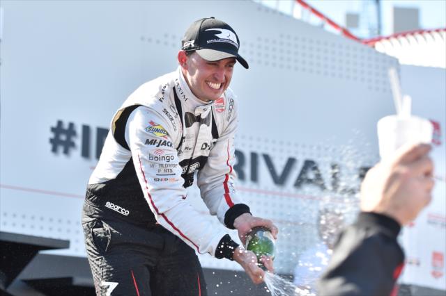 Graham Rahal sprays the champagne in Victory Lane following his victory in the Honda Indy 200 at Mid-Ohio -- Photo by: Chris Owens