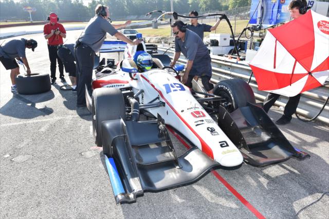 RC Enerson gets strapped into the No. 19 Scouting Honda during the team test at Mid-Ohio Sports Car Course -- Photo by: Chris Owens