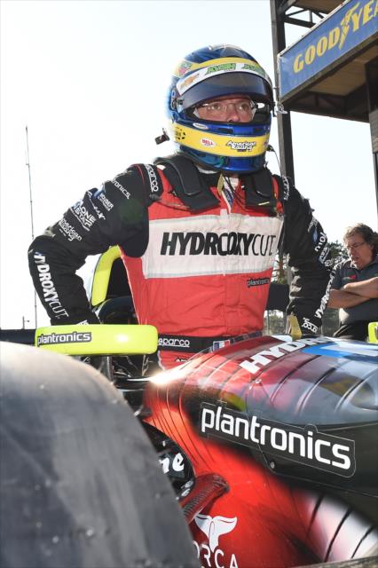 Sebastien Bourdais slides into his No. 11 Hydroxycut Chevrolet on pit lane during the team test at Mid-Ohio Sports Car Course -- Photo by: Chris Owens