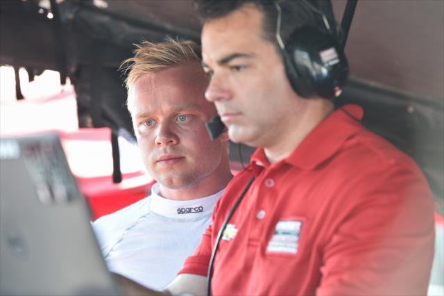 Felix Rosenqvist works with a Chip Ganassi Racing Teams engineer along pit lane during the team test at the Mid-Ohio Sports Car Course -- Photo by: Chris Owens