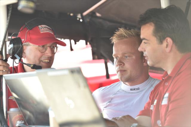Felix Rosenqvist chats with Chip Ganassi Racing engineers along pit lane during the team test at the Mid-Ohio Sports Car Course -- Photo by: Chris Owens