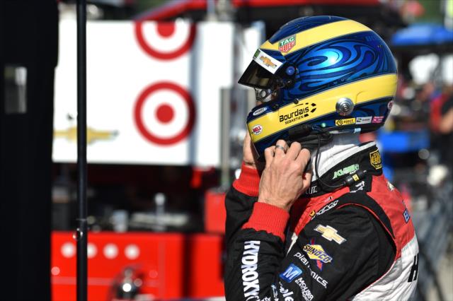 Sebastien Bourdais adjust his helmet straps along pit lane during the team test at the Mid-Ohio Sports Car Course -- Photo by: Chris Owens