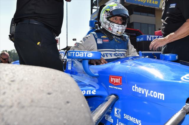 Tony Kanaan slides into his No. 10 NTT Data Chevrolet on pit lane during the team test at the Mid-Ohio Sports Car Course -- Photo by: Chris Owens