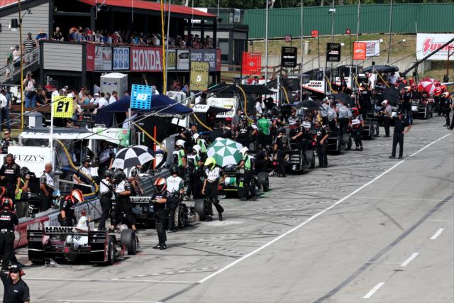 Pit lane starts to come to life prior to the final warmup for the Honda Indy 200 at Mid-Ohio -- Photo by: Bret Kelley