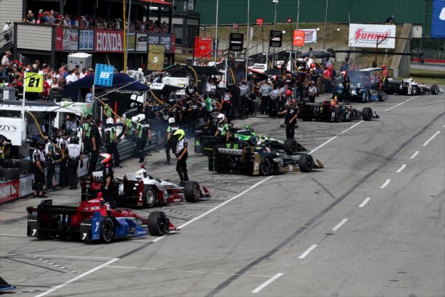 The field peels out of their stalls to start the final warmup for the Honda Indy 200 at Mid-Ohio -- Photo by: Bret Kelley