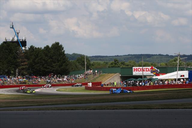 Tony Kanaan leads a group up the hill through Turn 1 during the Honda Indy 200 at Mid-Ohio -- Photo by: Bret Kelley