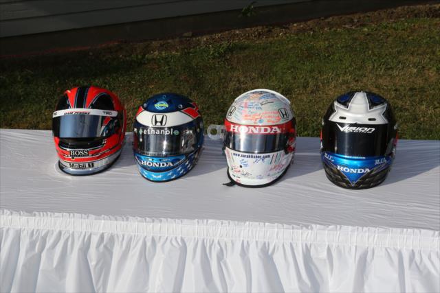 Recovered helmets of Helio Castroneves, Ryan Hunter-Reay, Sarah Fisher, and Ed Carpenter -- Photo by: Chris Jones