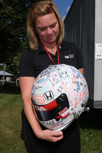 Sarah Fisher receives her fan-signed helmet from the 2006 Meijer 300 at Kentucky Speedway, previously believed lost. -- Photo by: Chris Jones