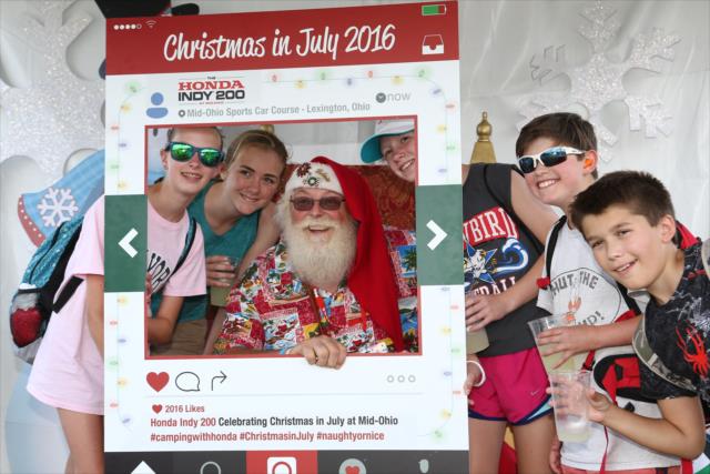 Santa Claus gets in on the selfie action in the INDYCAR Fan Village at the Mid-Ohio Sports Car Course -- Photo by: Chris Jones