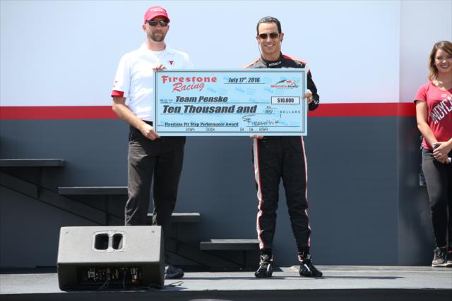 Helio Castroneves accepts the Firestone Pit Stop Performance award on behalf of Team Penske for their performance in Toronto -- Photo by: Chris Jones