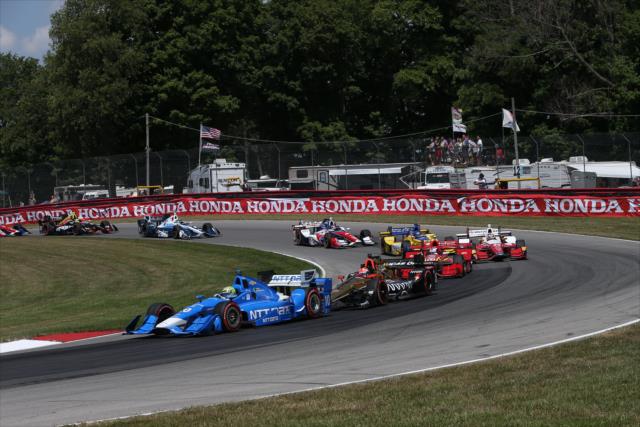 Tony Kanaan leads a group through the Turn 12 Carousel turn during the Honda Indy 200 at Mid-Ohio -- Photo by: Chris Jones
