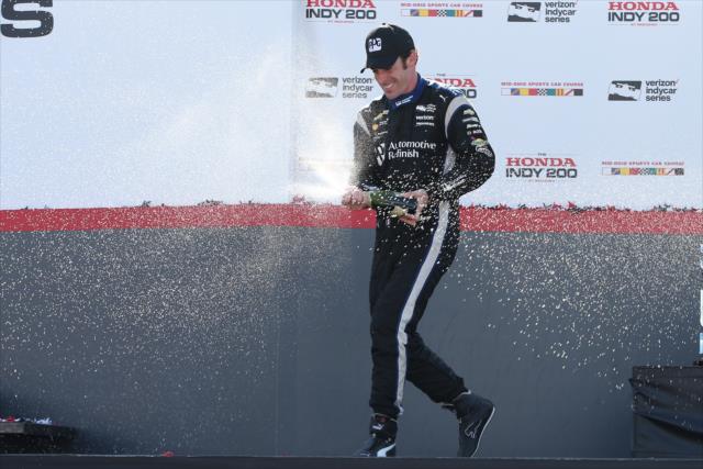 Simon Pagenaud sprays the champagne in Victory Circle following his victory in the Honda Indy 200 at Mid-Ohio -- Photo by: Chris Jones