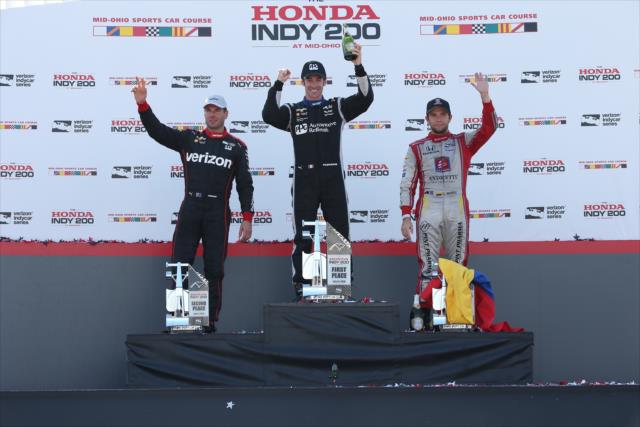 The podium of Simon Pagenaud, Will Power, and Carlos Munoz in Victory Circle following the Honda Indy 200 at Mid-Ohio -- Photo by: Chris Jones
