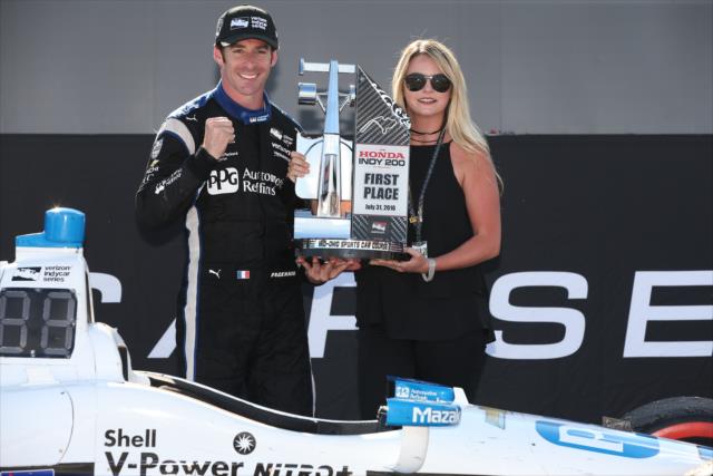 Simon Pagenaud and his girlfriend, Hailie, celebrate in Victory Circle after winning the Honda Indy 200 at Mid-Ohio -- Photo by: Chris Jones