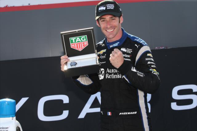 Simon Pagenaud shows his TAG Heuer winner's watch in Victory Circle following his win in the Honda Indy 200 at Mid-Ohio -- Photo by: Chris Jones
