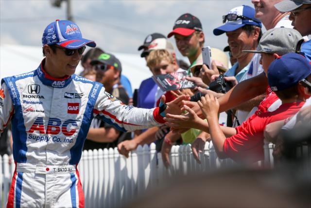 Takuma Sato greets the fans during pre-race introductions for the Honda Indy 200 at Mid-Ohio -- Photo by: Joe Skibinski