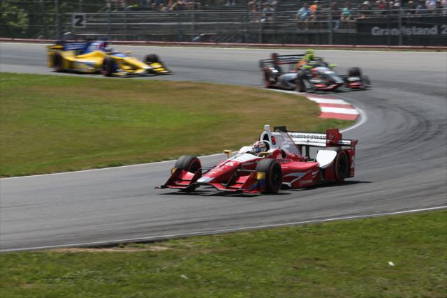 Carlos Munos leads a group through Turn 4 during the Honda Indy 200 at Mid-Ohio -- Photo by: Joe Skibinski
