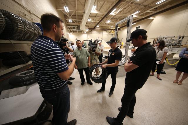 Scott Dixon and Indy Lights driver Ryan Normal look over specialized NASA wheels during their visit to the NASA Glenn Research Center in Cleveland, OH -- Photo by: Joe Skibinski