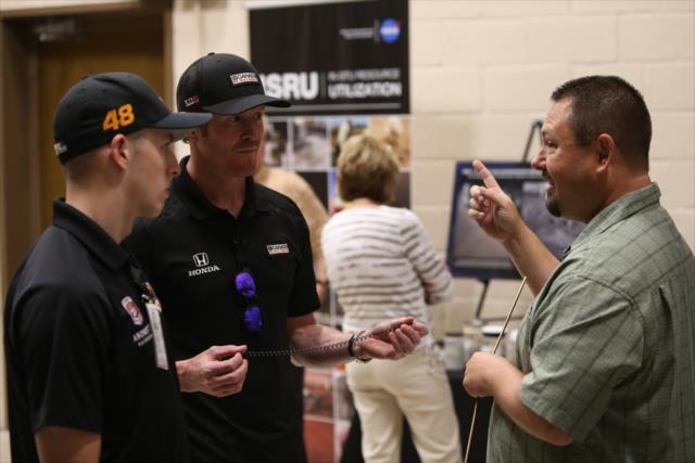 Scott Dixon and Indy Lights driver Ryan Norman chat with a NASA engineer during their tour of the NASA Glenn Research Center in Cleveland, OH -- Photo by: Joe Skibinski