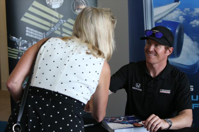 Scott Dixon greets a NASA engineer during an autograph session at the NASA Glenn Research Center in Cleveland, OH -- Photo by: Joe Skibinski