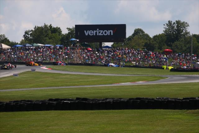 The field streams through the Turn 2 Keyhole turn during the Honda Indy 200 at Mid-Ohio -- Photo by: Bret Kelley