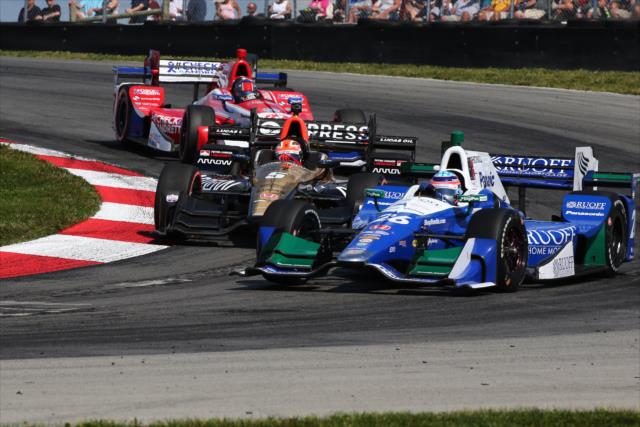 Takuma Sato battles with James Hinchcliffe and Alexander Rossi in Turn 2 during the Honda Indy 200 at Mid-Ohio -- Photo by: Bret Kelley