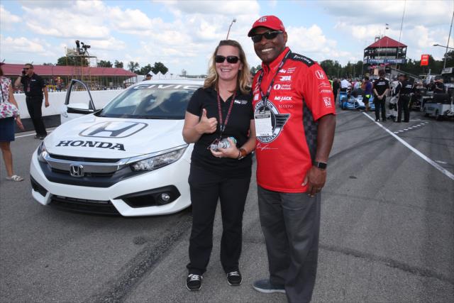 Sarah Fisher with Ohio State two-time Heisman Trophy winner Archie Griffin during pre-race festivities for the Honda Indy 200 at Mid-Ohio -- Photo by: Chris Jones