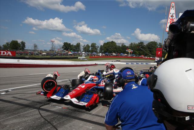 Carlos Munoz comes in for tires and fuel on pit lane during the Honda Indy 200 at Mid-Ohio -- Photo by: Chris Jones