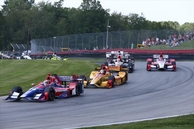 Alexander Rossi leads a group into the Turn 12 Carousel during the Honda Indy 200 at Mid-Ohio -- Photo by: Chris Jones
