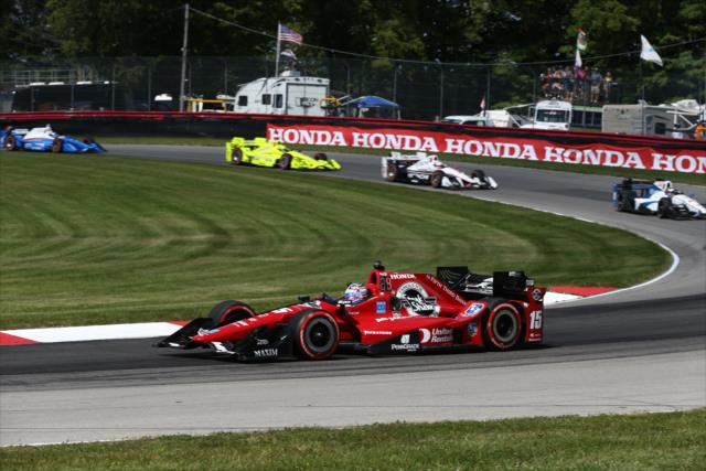 Graham Rahal leads a group through the Turn 12 Carousel during the Honda Indy 200 at Mid-Ohio -- Photo by: Chris Jones