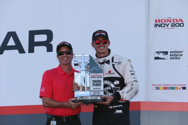 Graham Rahal accepts his 3rd Place trophy in Victory Circle following the Honda Indy 200 at Mid-Ohio -- Photo by: Chris Jones