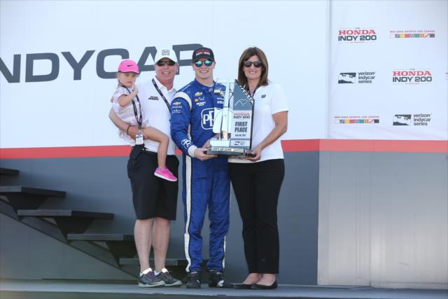 Josef Newgarden accepts his 1st Place trophy in Victory Circle after winning the Honda Indy 200 at Mid-Ohio -- Photo by: Chris Jones