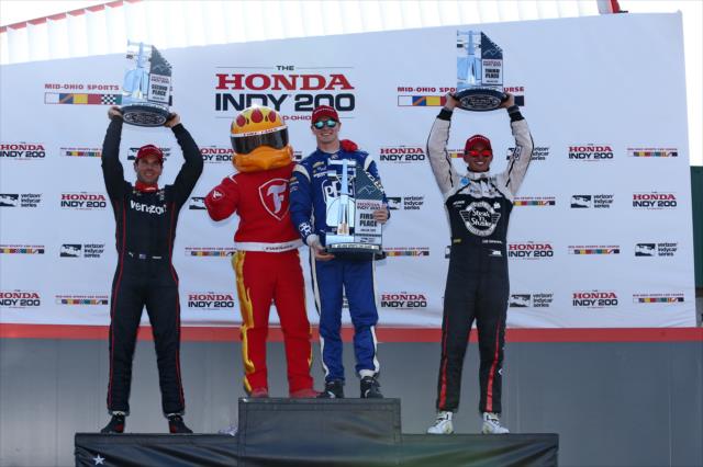 The podium of Josef Newgarden, Will Power, and Graham Rahal with the Firestone Firehawk in Victory Circle following the Honda Indy 200 at Mid-Ohio -- Photo by: Chris Jones