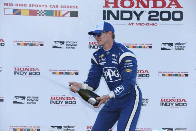 Josef Newgarden sprays the champagne in Victory Circle after winning the Honda Indy 200 at Mid-Ohio -- Photo by: Chris Jones