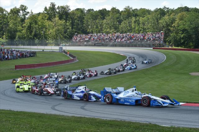 Josef Newgarden leads the field through Madness of Turns 4-5 during the Honda Indy 200 at Mid-Ohio -- Photo by: Chris Owens