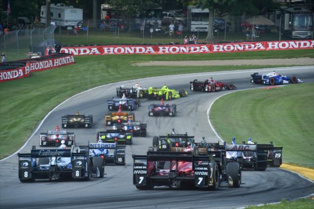 The field streams through Turns 5-6 during the start of the Honda Indy 200 at Mid-Ohio -- Photo by: Chris Owens