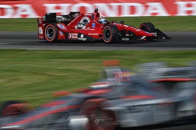 Graham Rahal races down Will power into the Turn 12 Carousel during the Honda Indy 200 at Mid-Ohio -- Photo by: Chris Owens