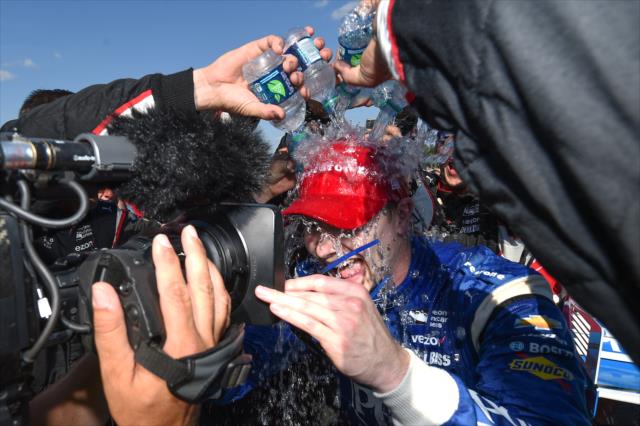 Josef Newgarden gets a cold shower in Victory Lane from his Team Penske crew after winning the Honda Indy 200 at Mid-Ohio -- Photo by: Chris Owens
