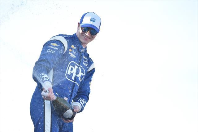 Josef Newgarden sprays the champagne in Victory Circle after winning the Honda Indy 200 at Mid-Ohio -- Photo by: Chris Owens