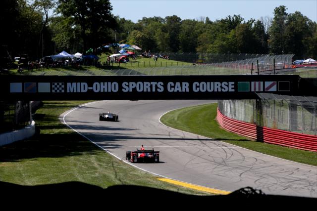 Helio Castroneves and Graham Rahal roll through Thunder Valley toward Turn 10 during the final warmup for the Honda Indy 200 at Mid-Ohio -- Photo by: Joe Skibinski
