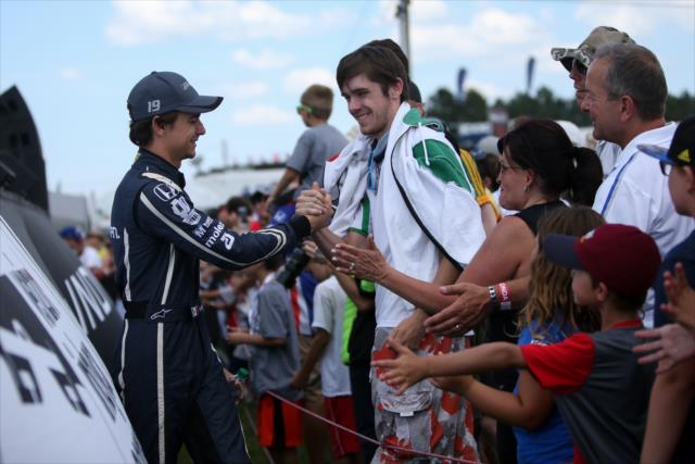Esteban Gutierrez greets the fans during pre-race introductions for the Honda Indy 200 at Mid-Ohio -- Photo by: Joe Skibinski