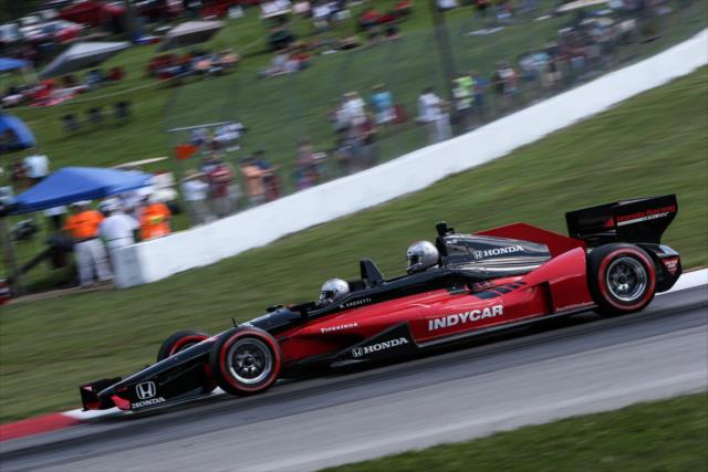 Mario Andretti and former Cleveland Indians player Travis Hafner in the two-seater during the parade laps before the Honda Indy 200 at Mid-Ohio -- Photo by: Joe Skibinski