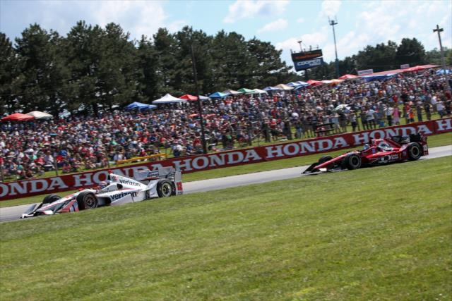 Will Power and Graham Rahal battle up the Turn 5 hill during the Honda Indy 200 at Mid-Ohio -- Photo by: Joe Skibinski