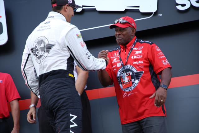 Graham Rahal greets Ohio State Buckeyes legend Archie Griffin on stage during pre-race festivities for the Honda Indy 200 at Mid-Ohio -- Photo by: Matt Fraver